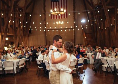 Bride and Groom having their first dance inside the Big Red Barn