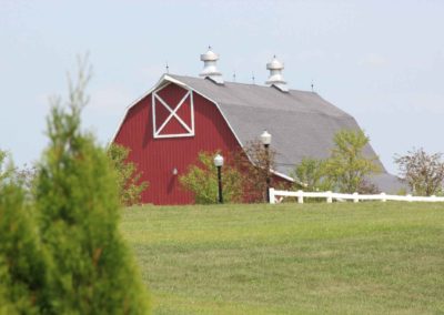 distance shot of the Big Red Barn from across the property