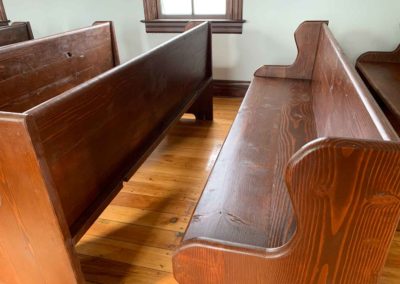 back of pews showing rustic and simple construction