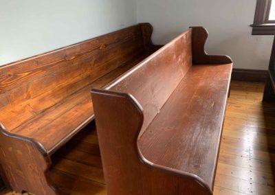 back of pews showing rustic and simple construction