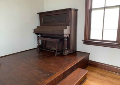 view of antique piano on stage