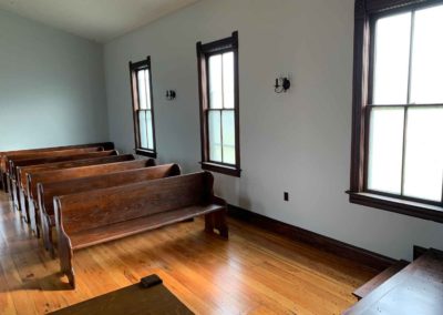view of north windows and pews