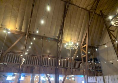 looking up at the lighting and balcony from ground floor in the Big Red Barn