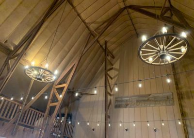 Wagon wheel chandeliers in the Big Red Barn